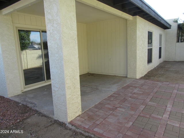 doorway to property featuring a patio