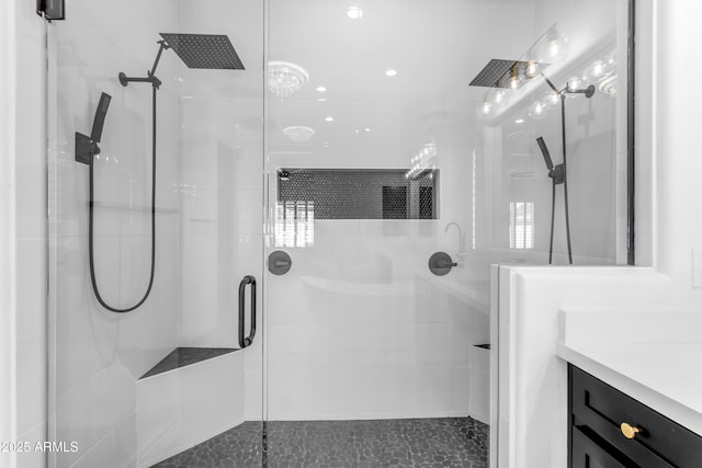 full bathroom featuring a shower stall and vanity