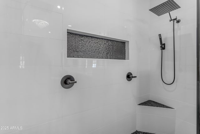 full bath with tiled shower