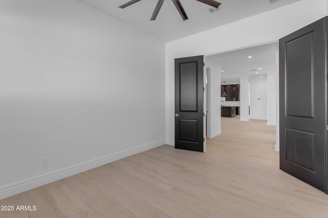 unfurnished room featuring light wood finished floors, recessed lighting, visible vents, a ceiling fan, and baseboards