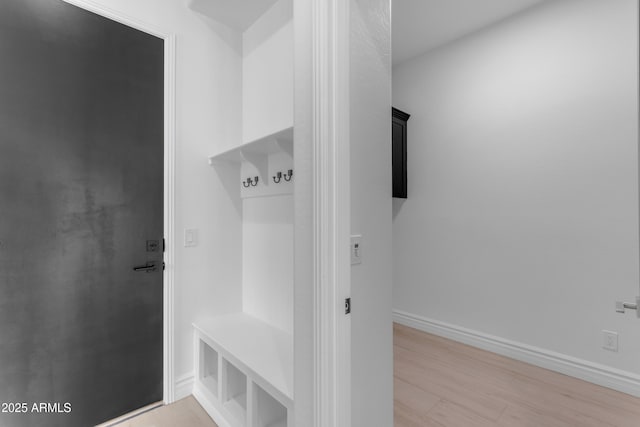 mudroom with light wood-style flooring and baseboards