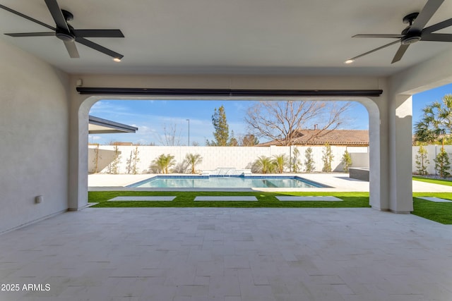 view of patio / terrace featuring a ceiling fan, a fenced in pool, and a fenced backyard