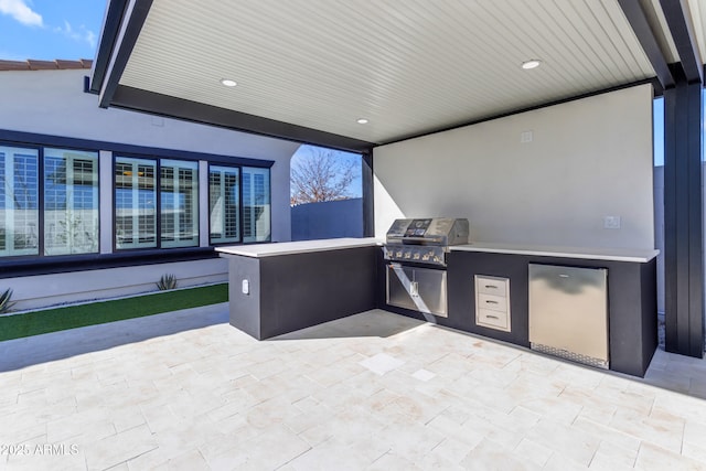 view of patio with grilling area and exterior kitchen