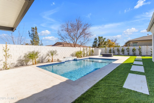 view of swimming pool featuring a fenced in pool, a patio area, a fenced backyard, and a yard