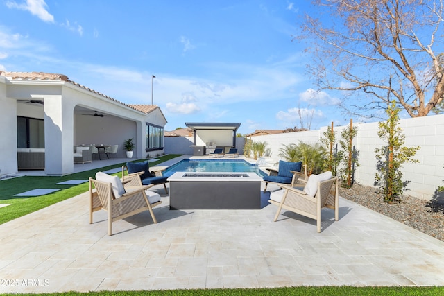 view of patio with an outdoor living space, a fenced backyard, a ceiling fan, and a fenced in pool