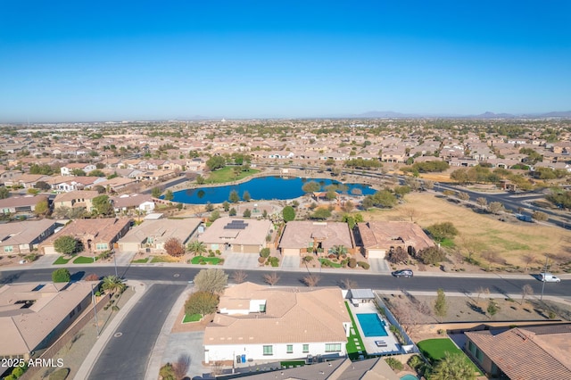 birds eye view of property with a residential view and a water view