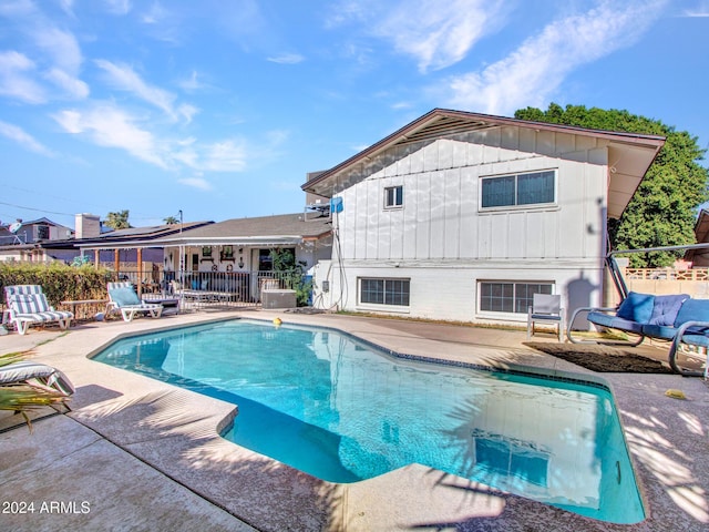 view of swimming pool with a patio area