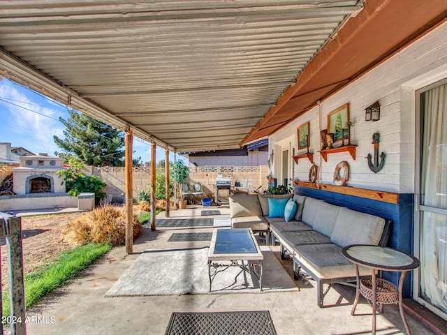 view of patio featuring exterior fireplace