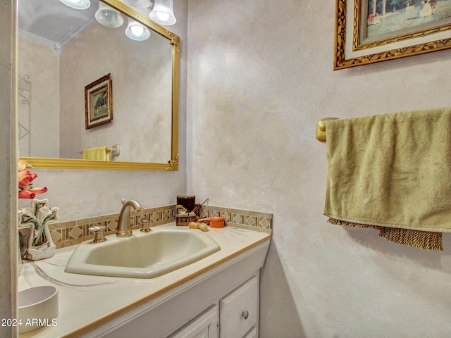 bathroom featuring vanity and ornamental molding