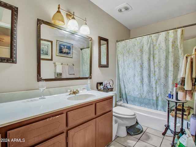 full bathroom featuring tile patterned flooring, vanity, toilet, and shower / tub combo