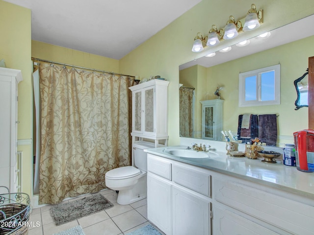 bathroom with tile patterned floors, vanity, and toilet