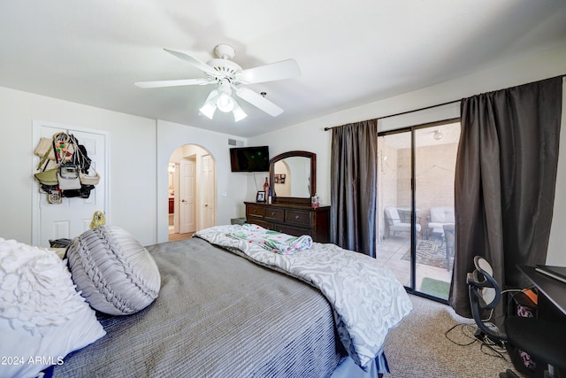 carpeted bedroom with ceiling fan and access to exterior