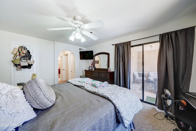 bedroom featuring light carpet, ceiling fan, and access to exterior