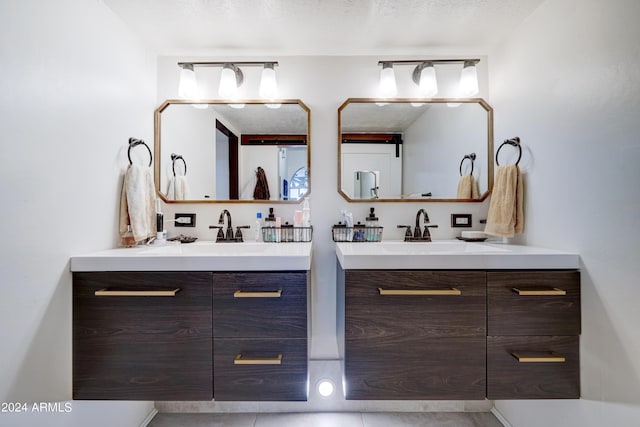 bathroom with vanity and a textured ceiling