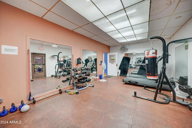 exercise room with a drop ceiling