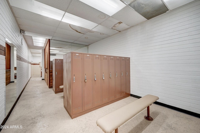 workout area with a paneled ceiling