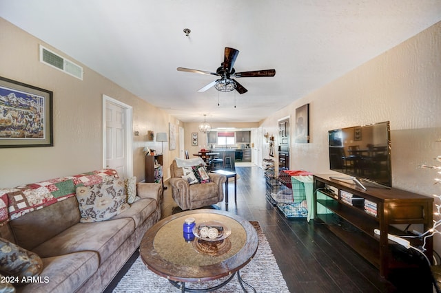 living room featuring ceiling fan and wood-type flooring