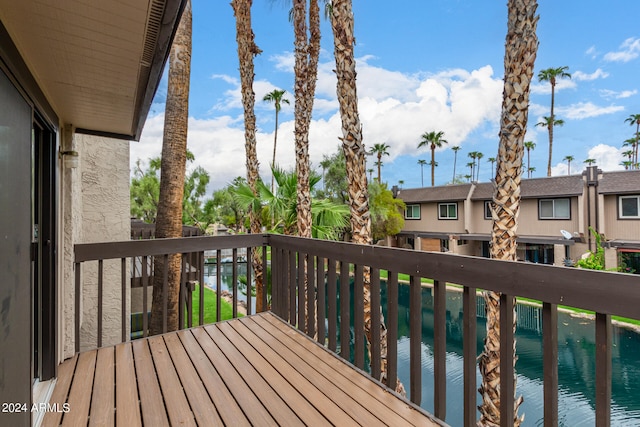 wooden deck with a water view