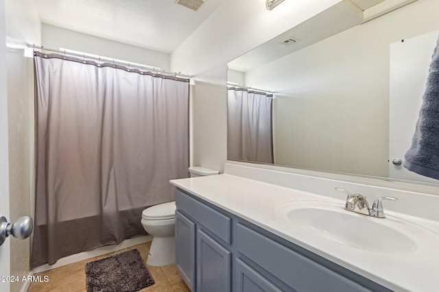 full bathroom featuring toilet, shower / tub combo, vanity, and tile patterned floors