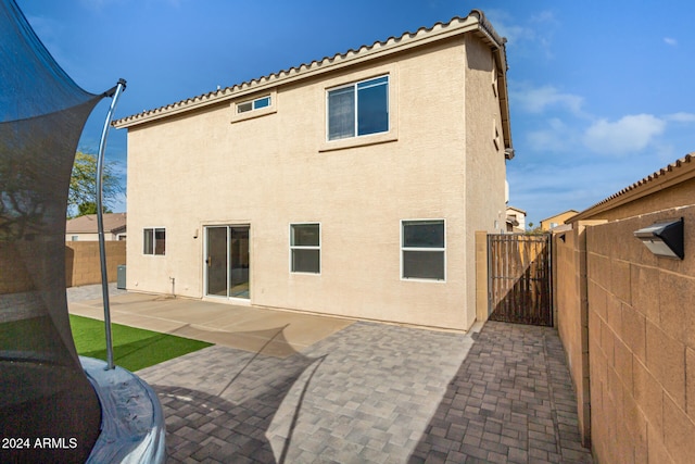 rear view of property featuring a patio