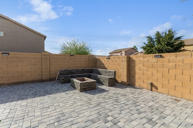 view of patio / terrace featuring an outdoor fire pit