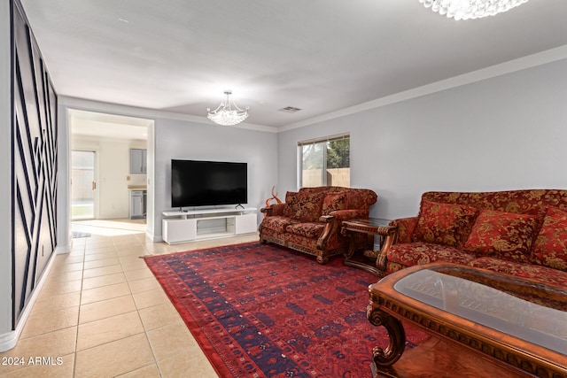 tiled living room featuring ornamental molding and a notable chandelier