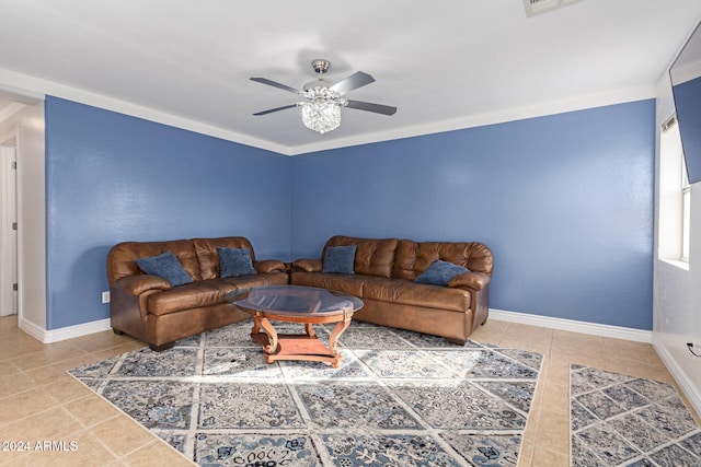 tiled living room with ceiling fan and ornamental molding