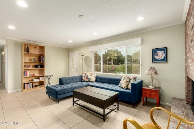 living area featuring a textured ceiling, light tile patterned flooring, baseboards, ornamental molding, and a brick fireplace