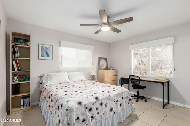 bedroom featuring ceiling fan, baseboards, and light tile patterned floors