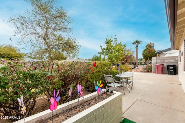 view of patio / terrace featuring fence