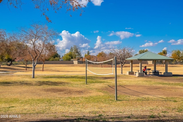 view of property's community featuring a gazebo, a lawn, and volleyball court