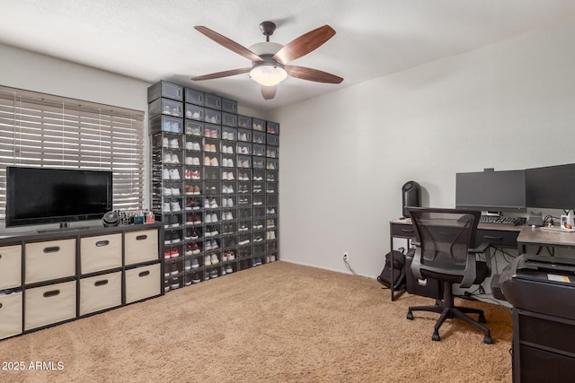 home office with ceiling fan and light colored carpet