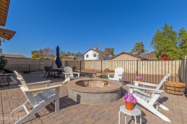 view of patio / terrace with a fire pit