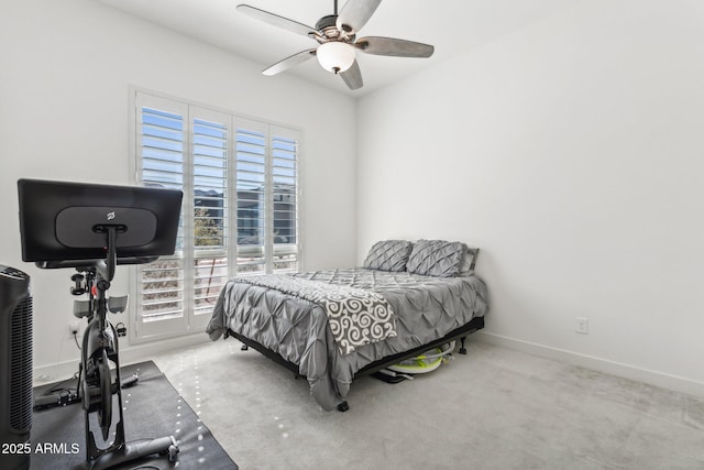 carpeted bedroom featuring a ceiling fan and baseboards