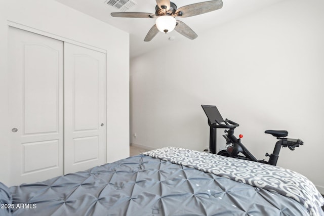 bedroom with a closet, visible vents, and ceiling fan