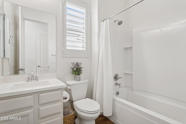 bathroom featuring toilet, shower / bath combo, and vanity