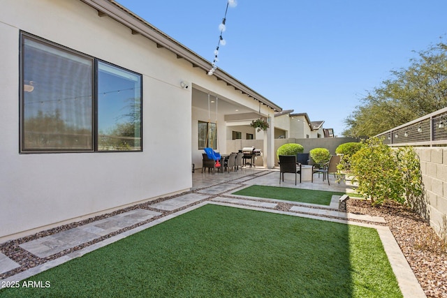 view of yard with a patio area and a fenced backyard