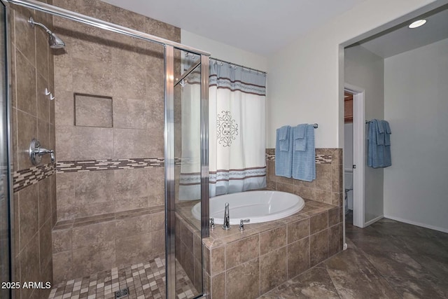 bathroom with separate shower and tub