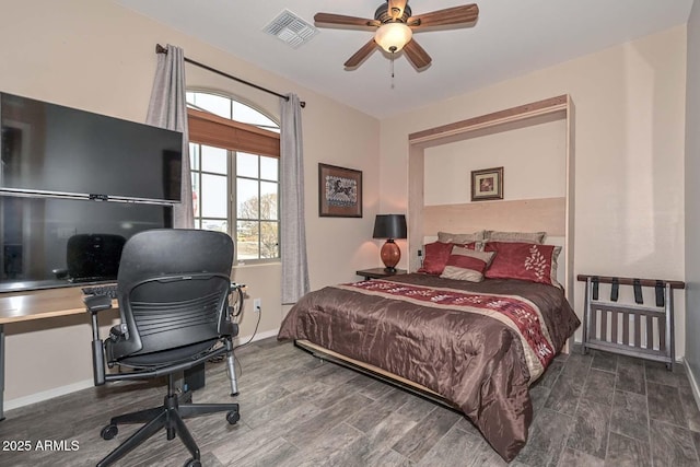 bedroom featuring dark hardwood / wood-style flooring and ceiling fan