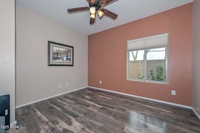 unfurnished room featuring dark hardwood / wood-style floors and ceiling fan