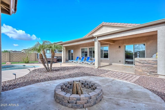 view of patio / terrace with an outdoor fire pit