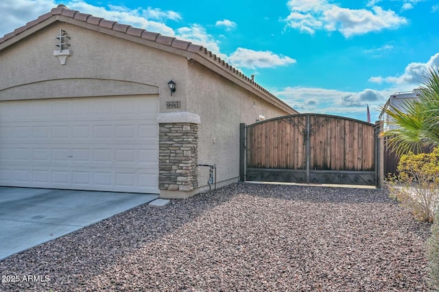 view of side of property featuring a garage