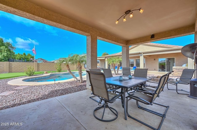 view of patio with a fenced in pool