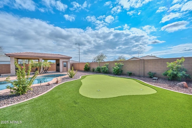 view of yard featuring a fenced in pool and a gazebo