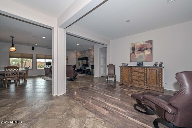 living area featuring a large fireplace