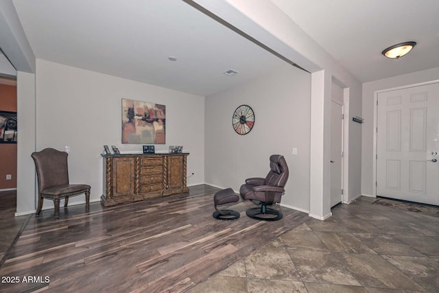 living area with dark hardwood / wood-style flooring