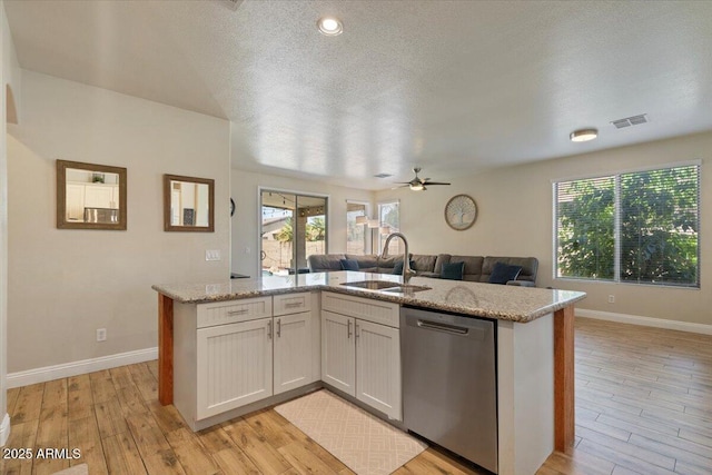 384 N Scott Dr, Chandler, AZ 85225 - kitchen featuring visible vents, a ceiling fan, stainless steel dishwasher, a sink, and open floor plan
