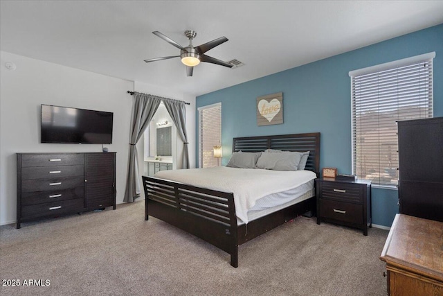 384 N Scott Dr, Chandler, AZ 85225 - bedroom featuring light carpet, a ceiling fan, visible vents, and connected bathroom