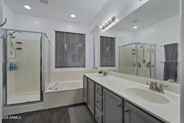 384 N Scott Dr, Chandler, AZ 85225 - full bathroom featuring a bath, wood finished floors, a sink, and a stall shower