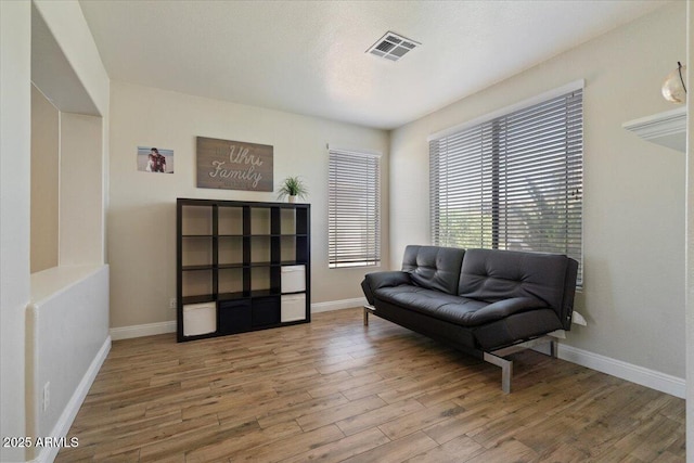 384 N Scott Dr, Chandler, AZ 85225 - living area with baseboards, wood finished floors, and visible vents